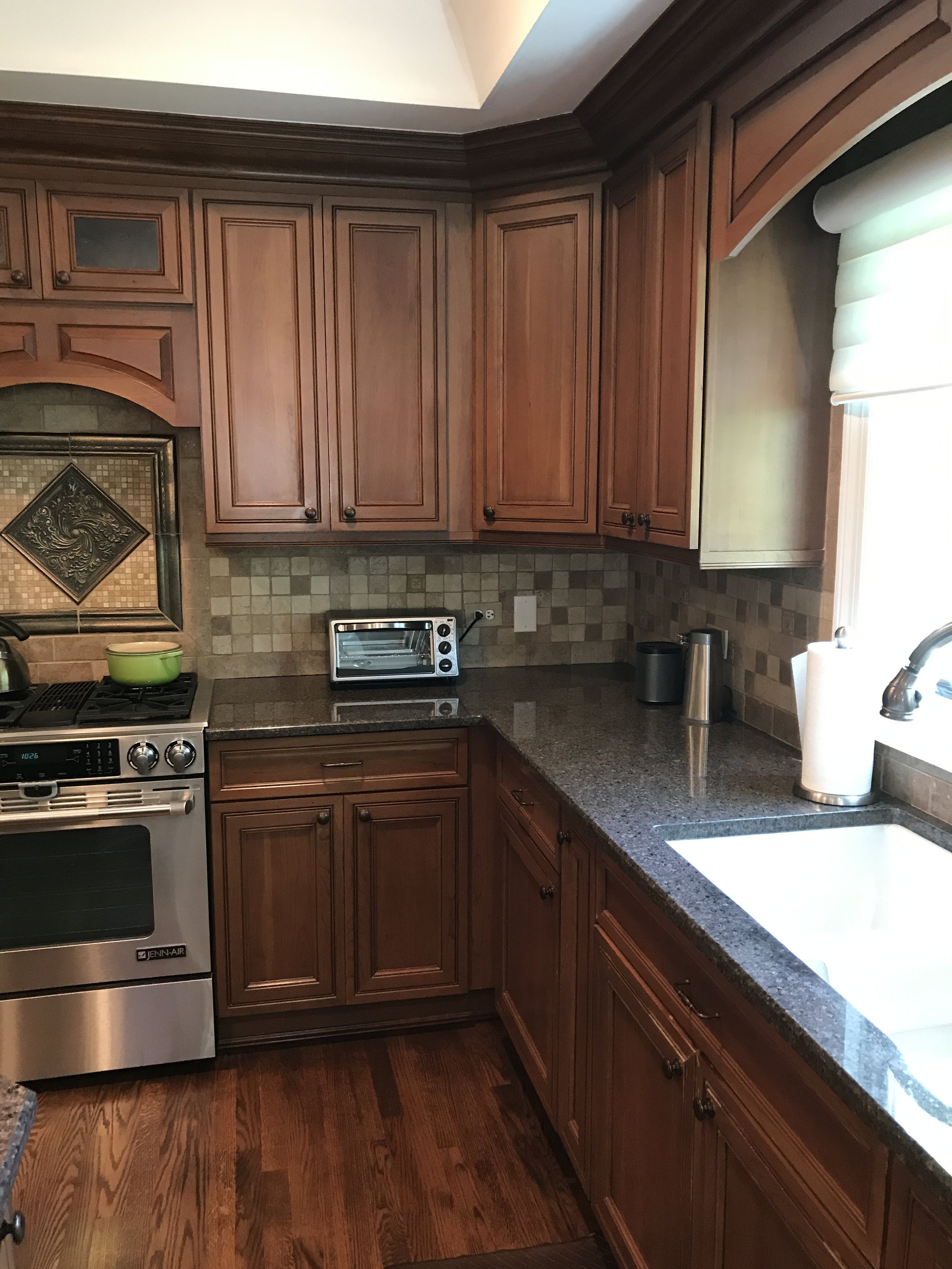 Beautiful Chef's Kitchen Medium Brown Glass Cabinets Stainless Steel ...