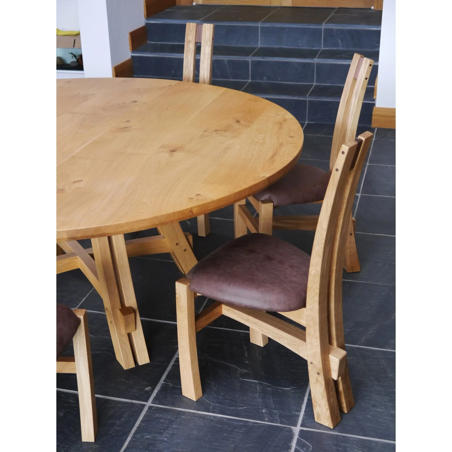 Close-up of Split-leg Dining Table and Chairs in Oak and Leather by Alasdair Wallace