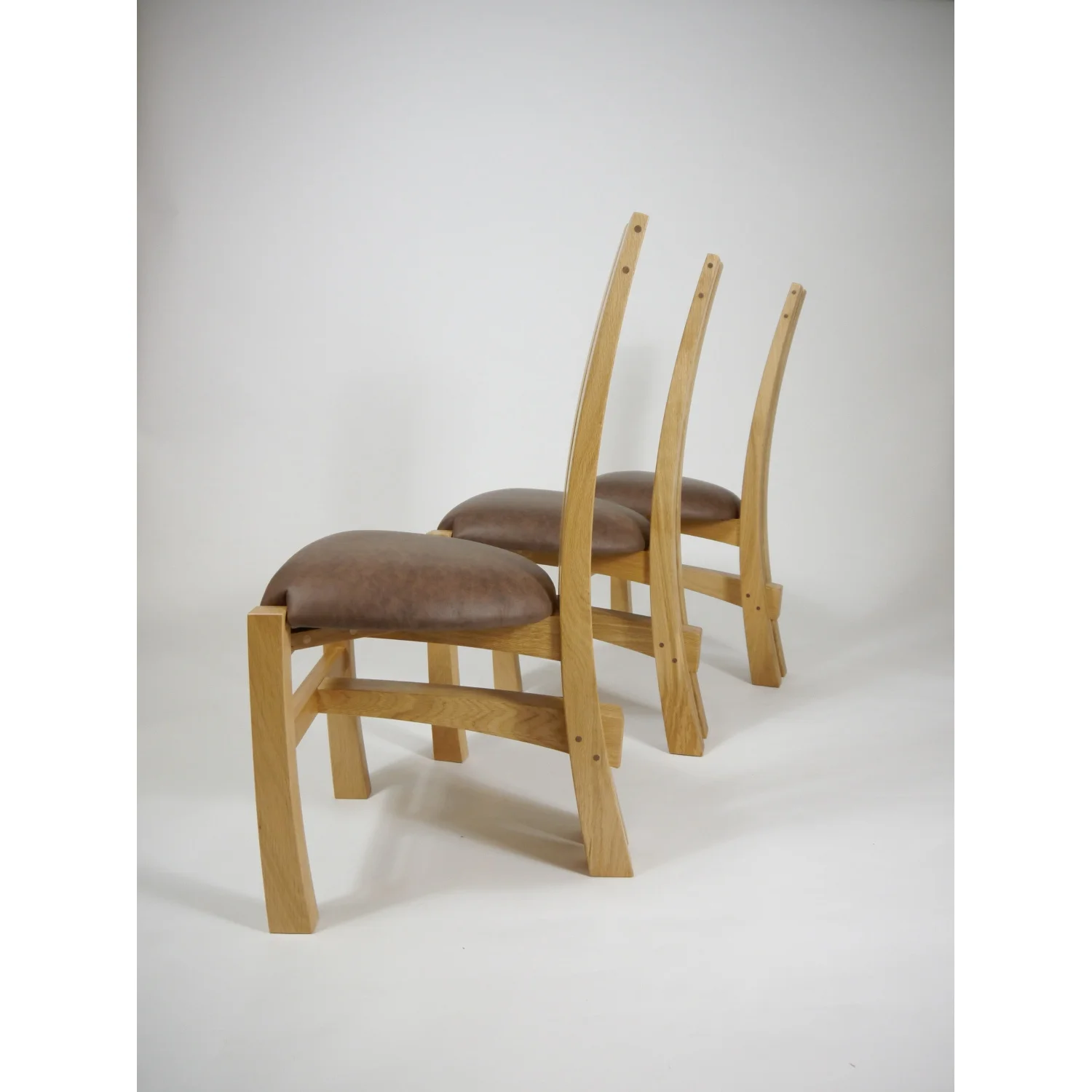 Side view of Split-leg Dining Chairs in Oak and Leather by Alasdair Wallace