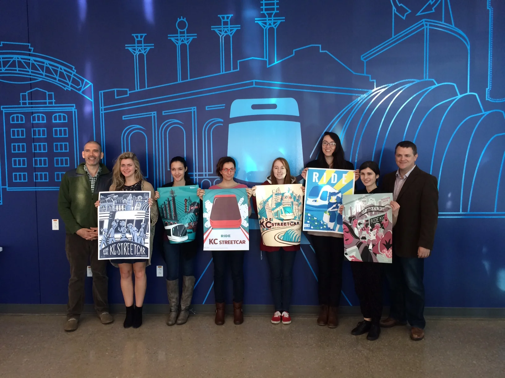 Pictured left to right at KC Streetcar Authority are KCAI Assistant Professor David Terrill, Kate Dittmann, Alicia Wyatt, Eren Mulhausen, Matti Crabtree, Emily Woodson, Karolina Akimov and Executive Director of the KC Streetcar Authority Tom Gerend.