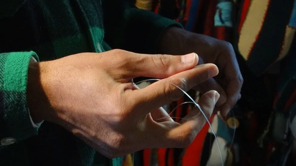 Stringing beads. Photo by Sharon Pendana.