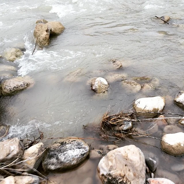 Here the river runs clean and creates rapids. Folk living near by can fish, swim, and put in boats where the river runs high. The river divides the US and Mexico with no border walls in site. 