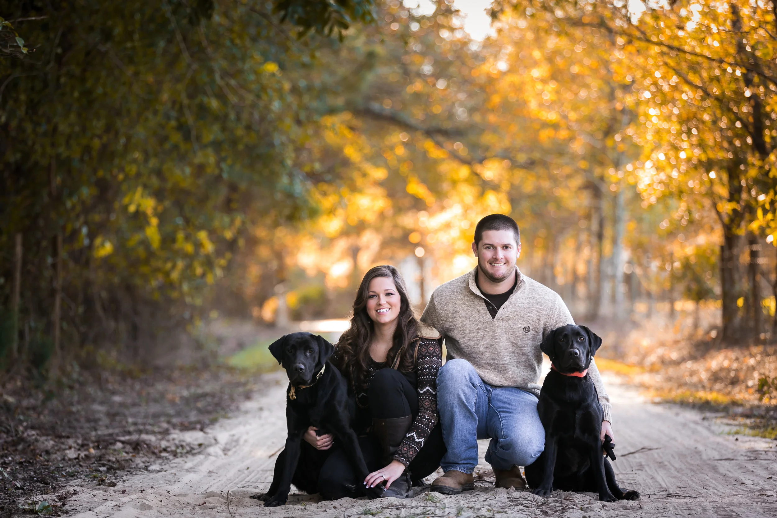 Couple On Country Road with Dogs - Engagement Portrait