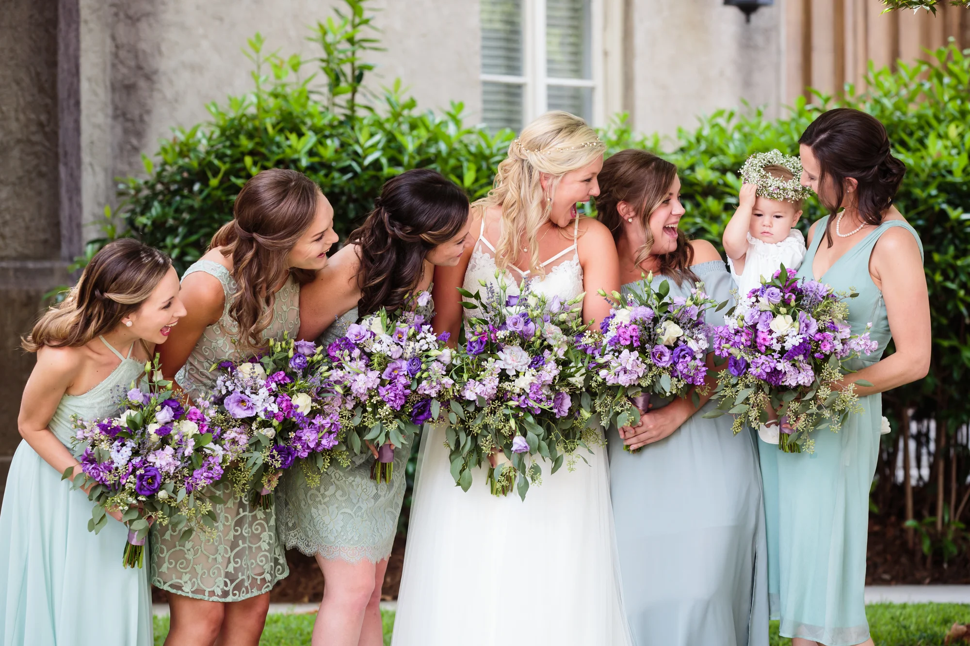 Bride with bridesmaids laughing