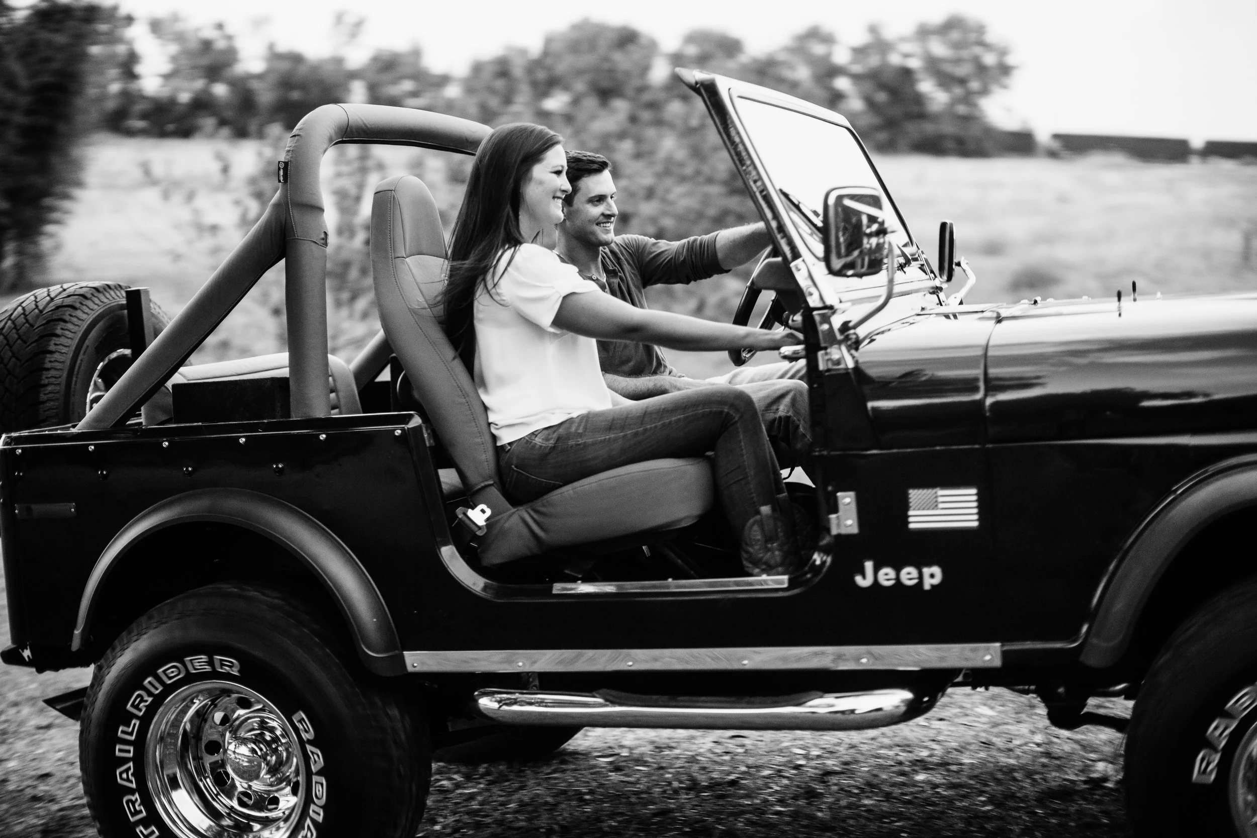 Couple Smiling in a Jeep - Engagement Portrait Ashah Photography