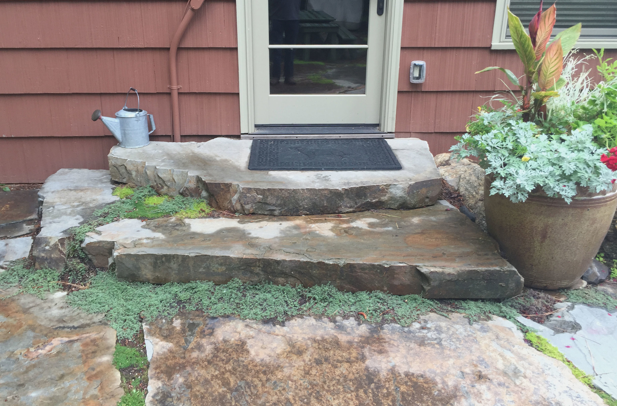lake cabin stone entry steps with thyme