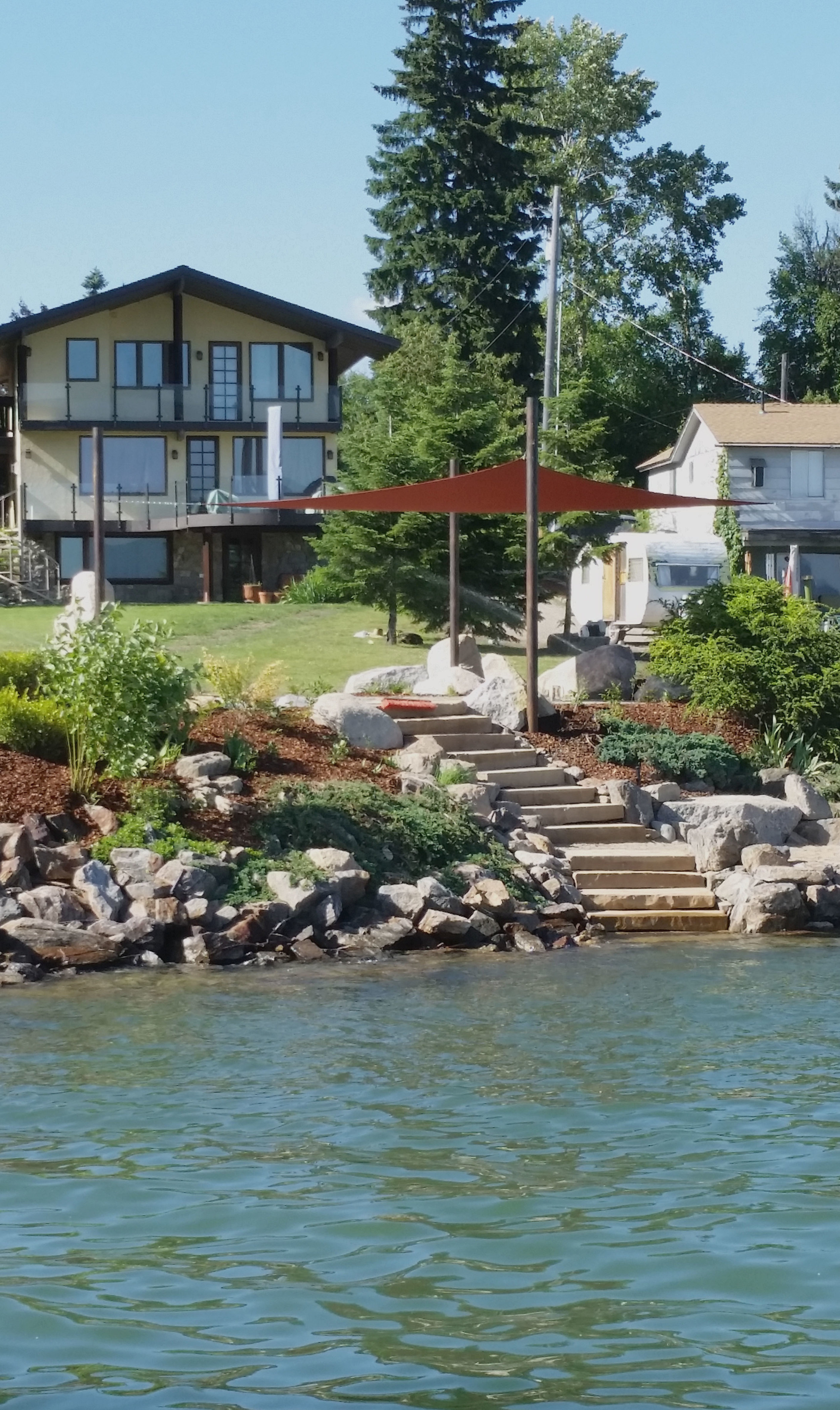 lakeside patio with shade sail