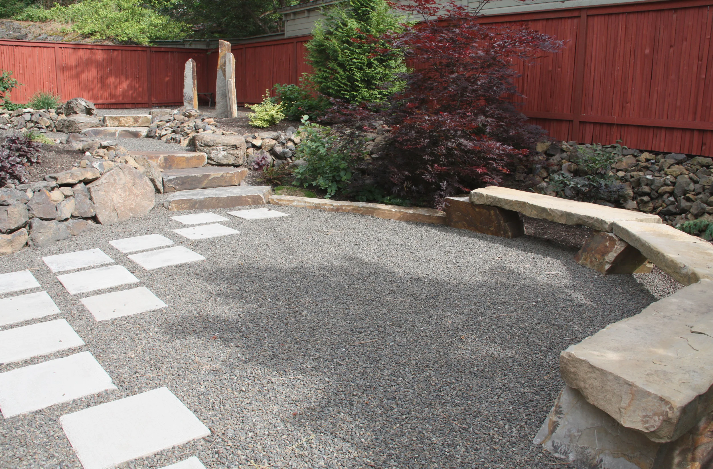 Concrete pavers set into this gravel patio create a more robust walking path.