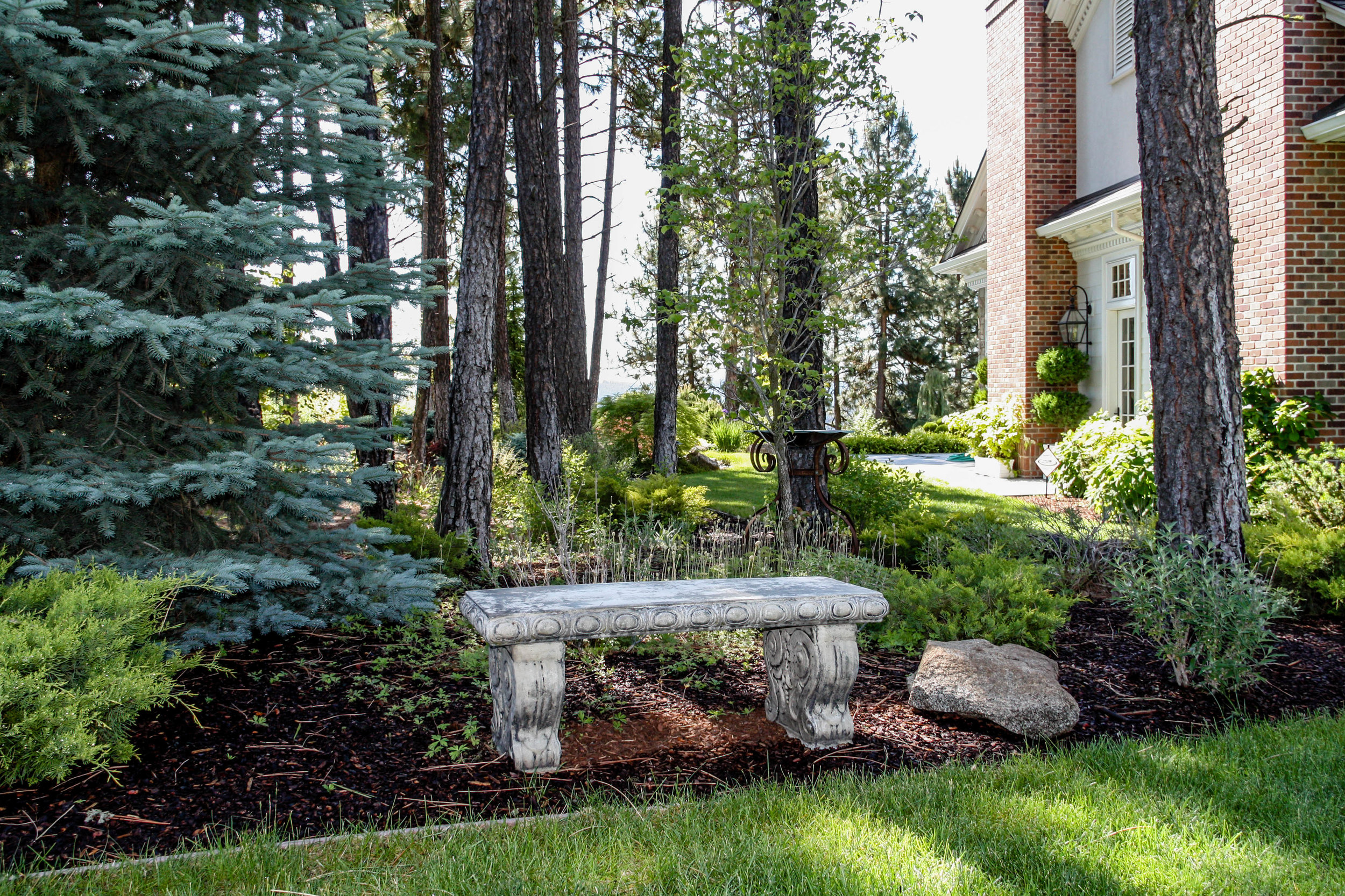 spokane rural estate landscaping bench in woods