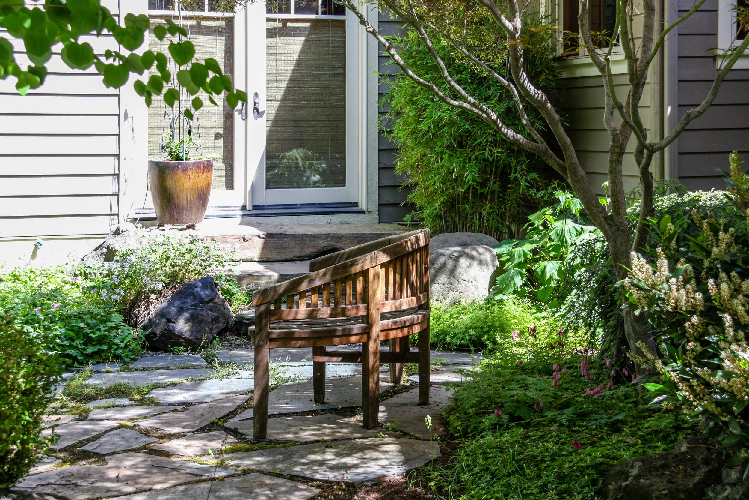 south hill craftsman with shady flagstone patio