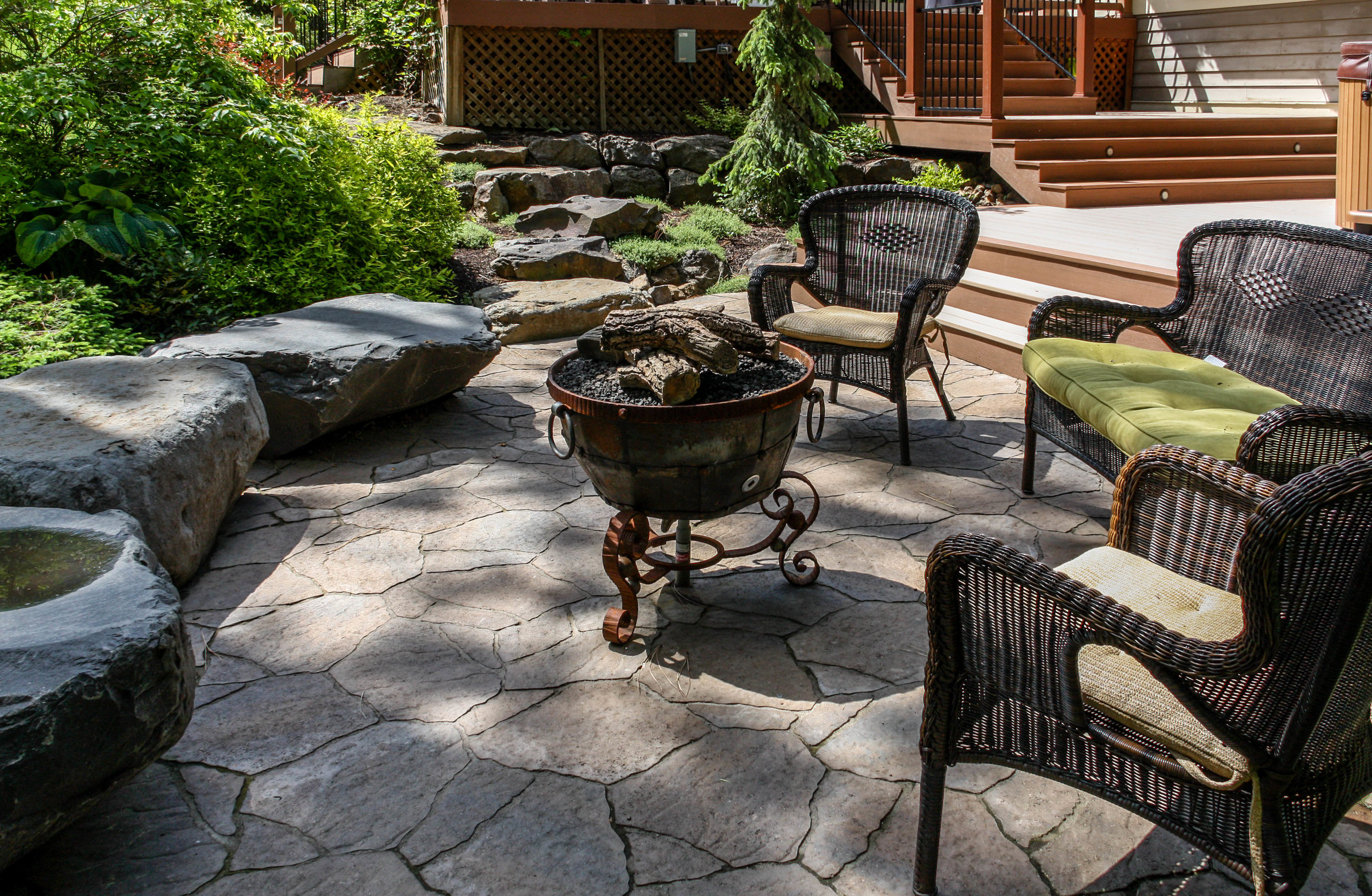 belgard mega arbel patio with fire pit and bench rocks