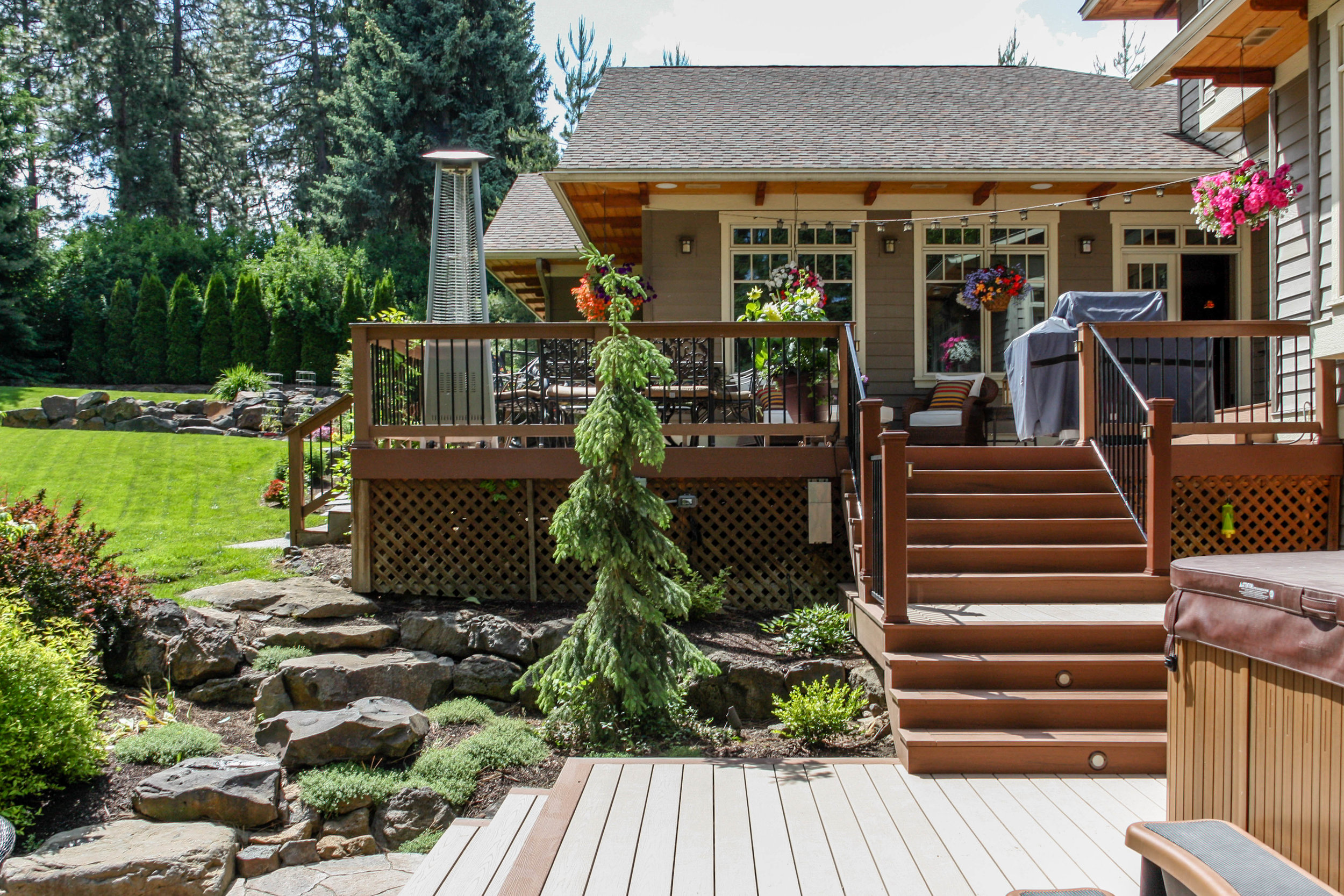 multilevel deck with boulder retaining wall and rock steps