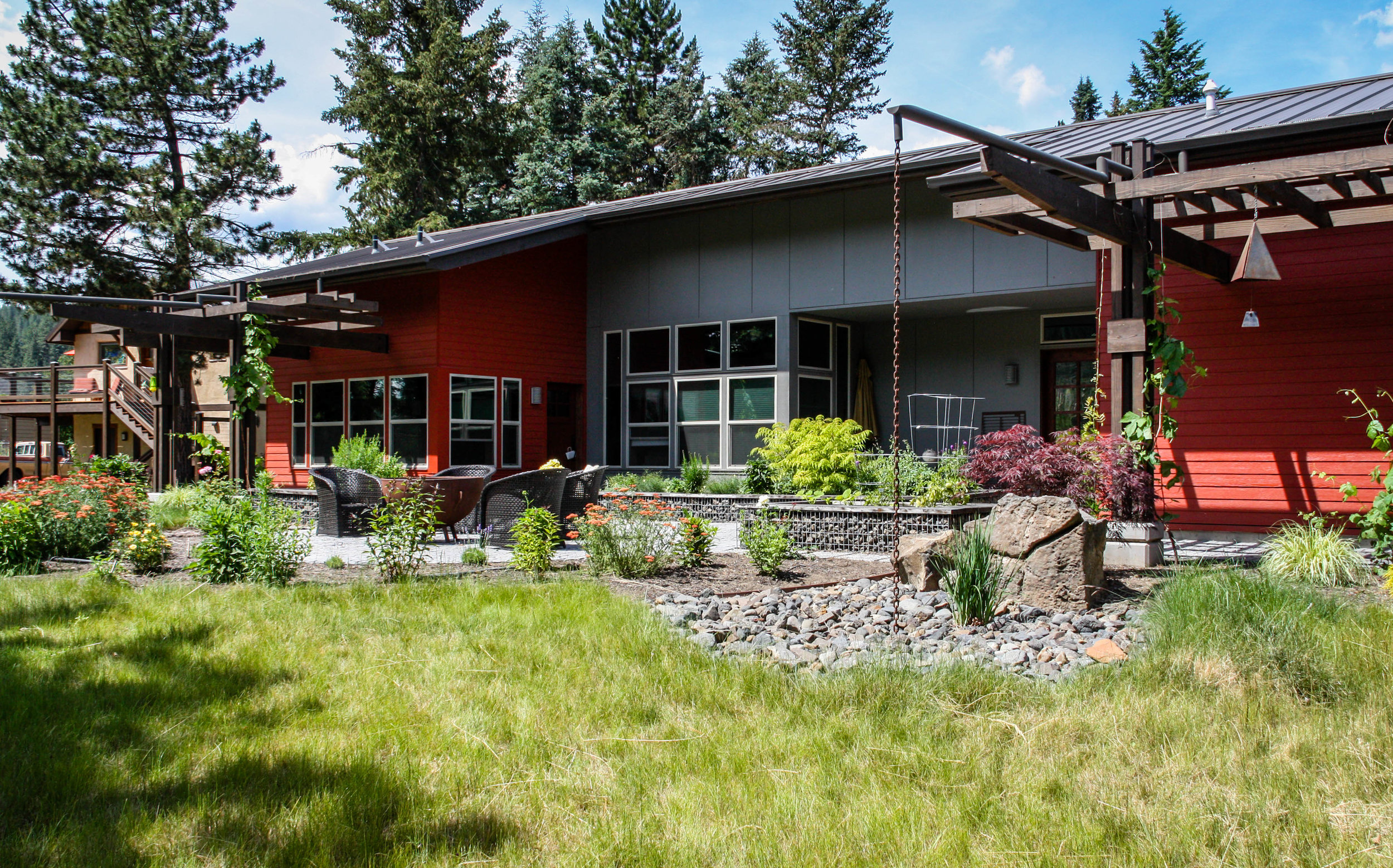 contemporary northwest landscaping with rain chains