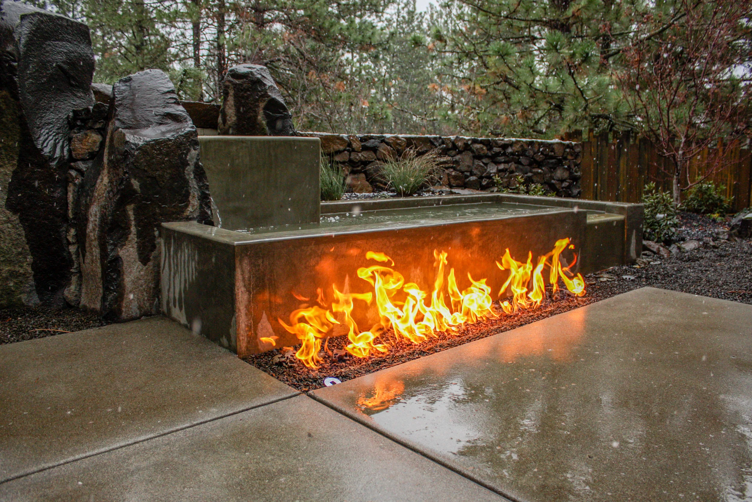 The mix of natural and man-made materials makes this water feature a unifying landscape feature.