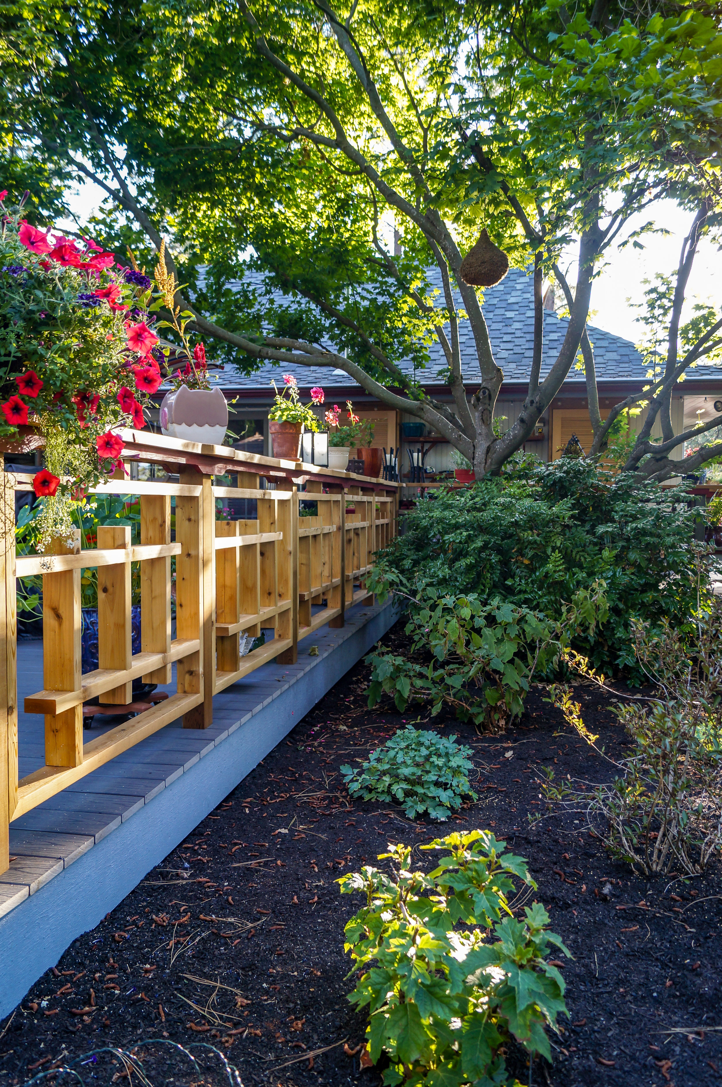 custom asian inspired wood railing for mid century deck in spokane