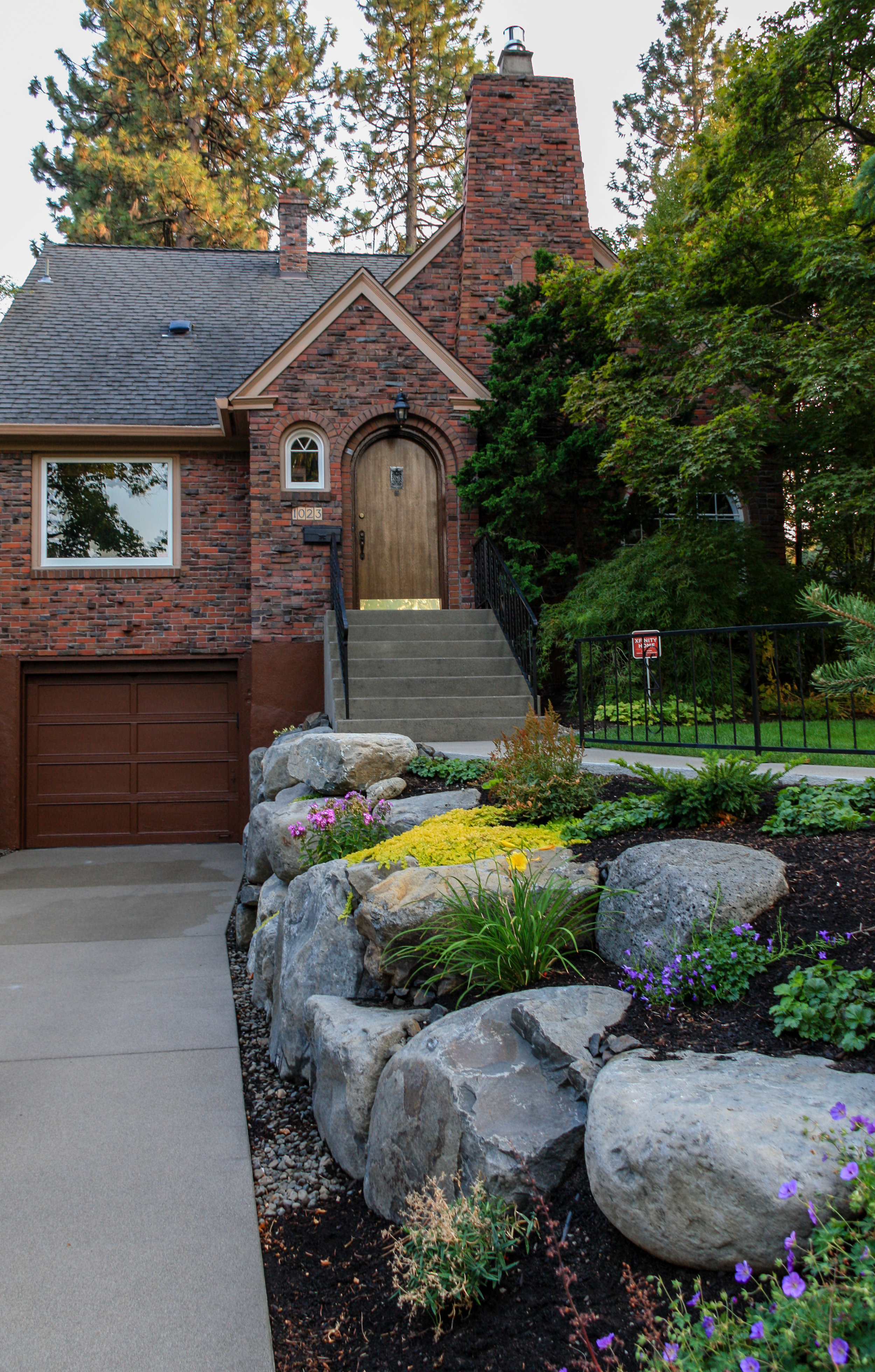 boulder retaining wall with landscaping for spokane 1930s bungalow