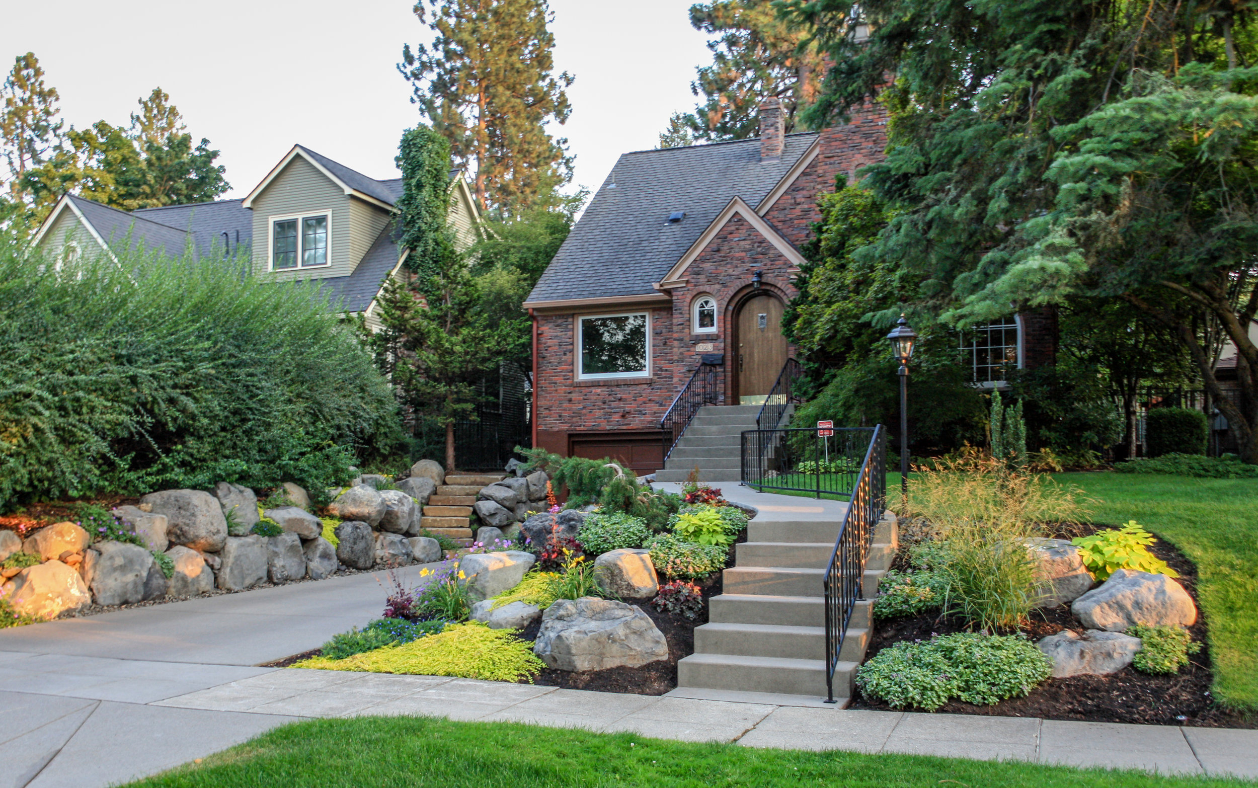 sandwashed concrete steps and driveway with landscaping in spokane