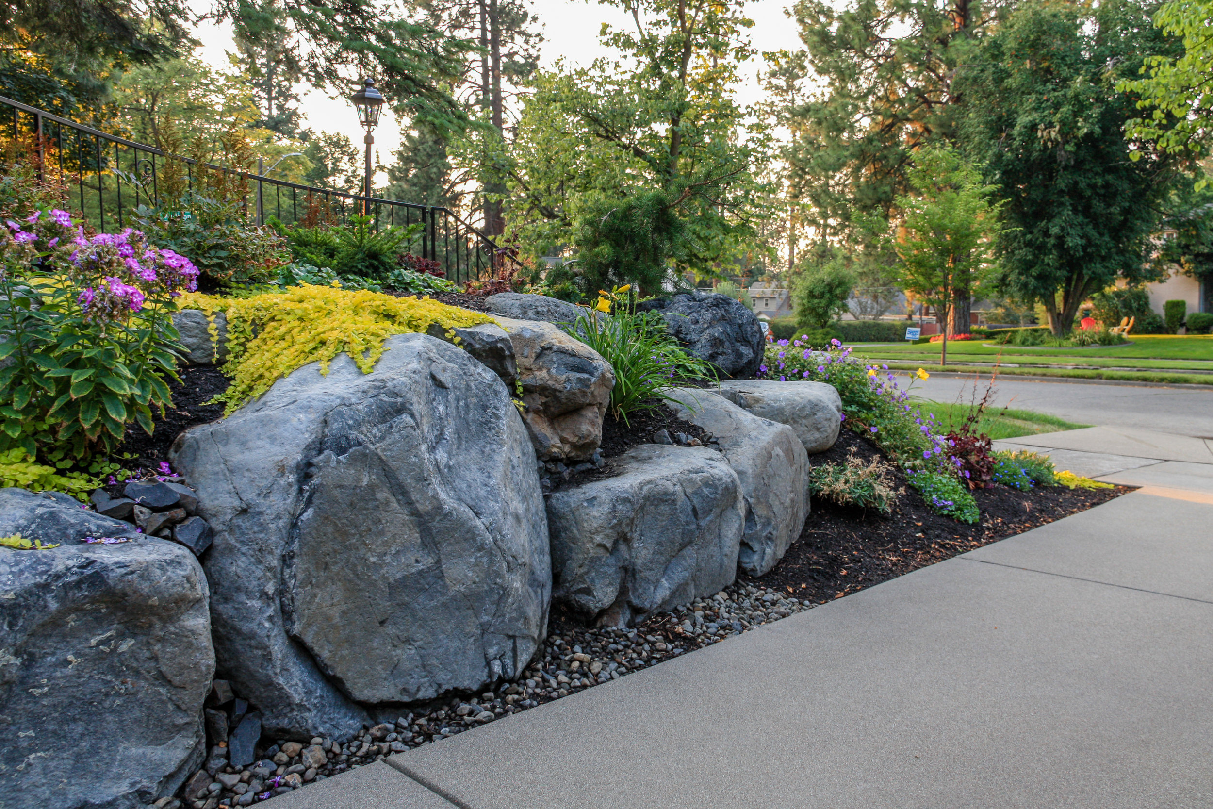 spokane boulder retaining wall with rock garden landscaping