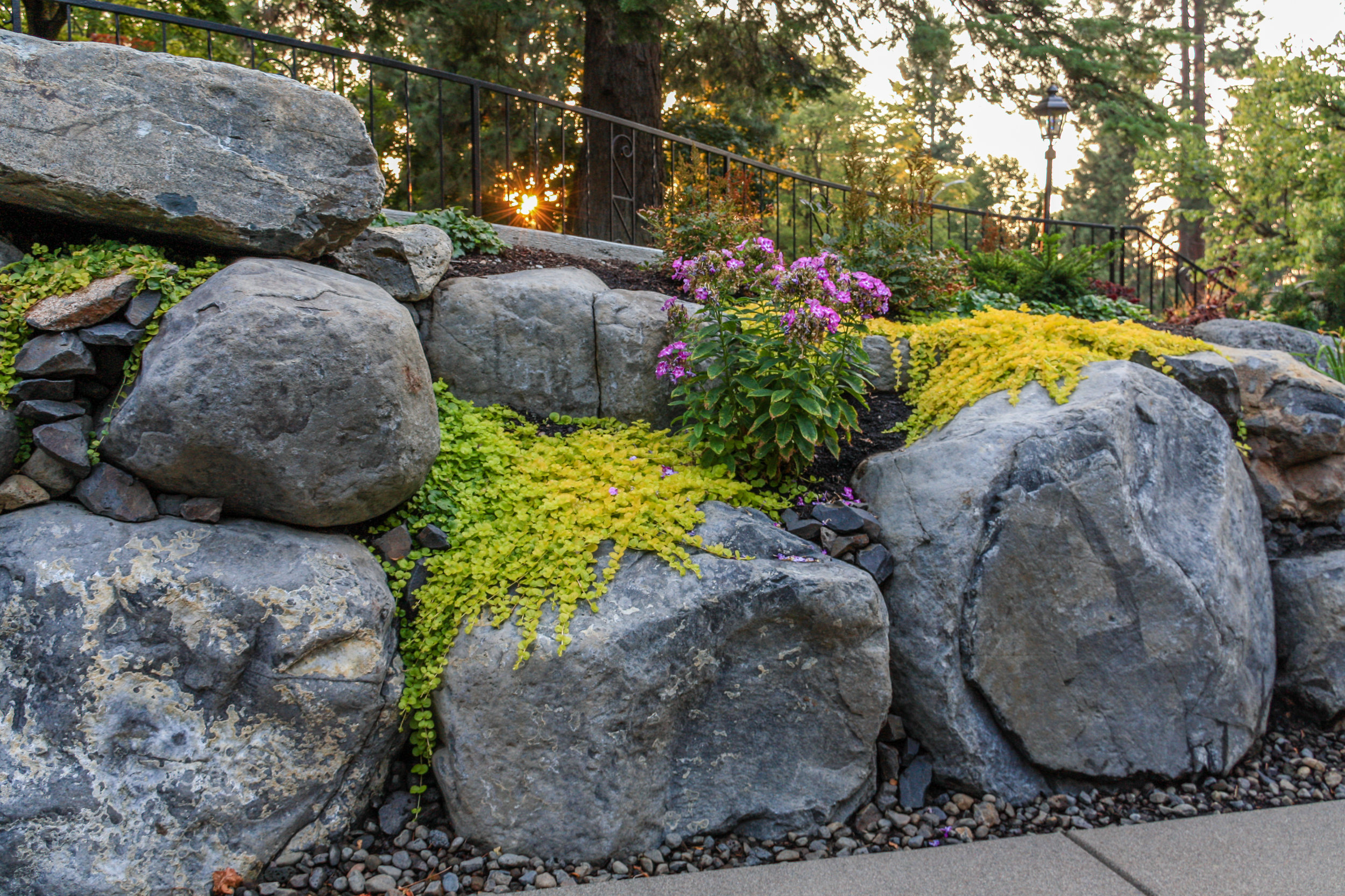 spokane boulder retaining wall with rock garden landscaping