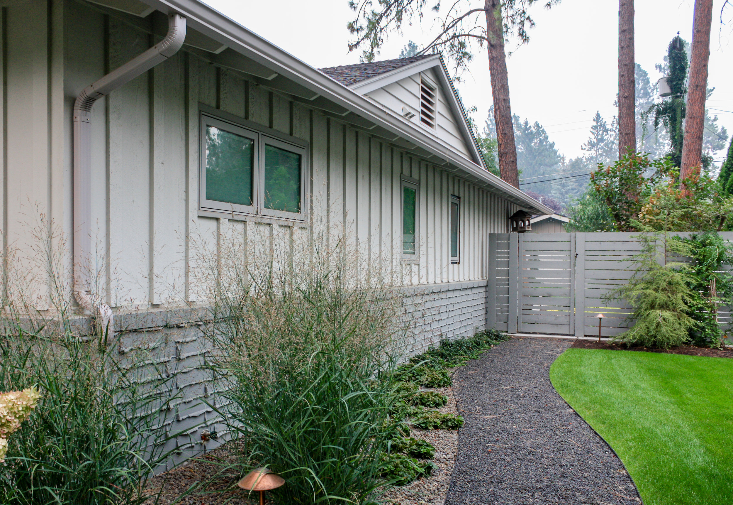 gravel pathway and horizontal wood fence on spokane south hill