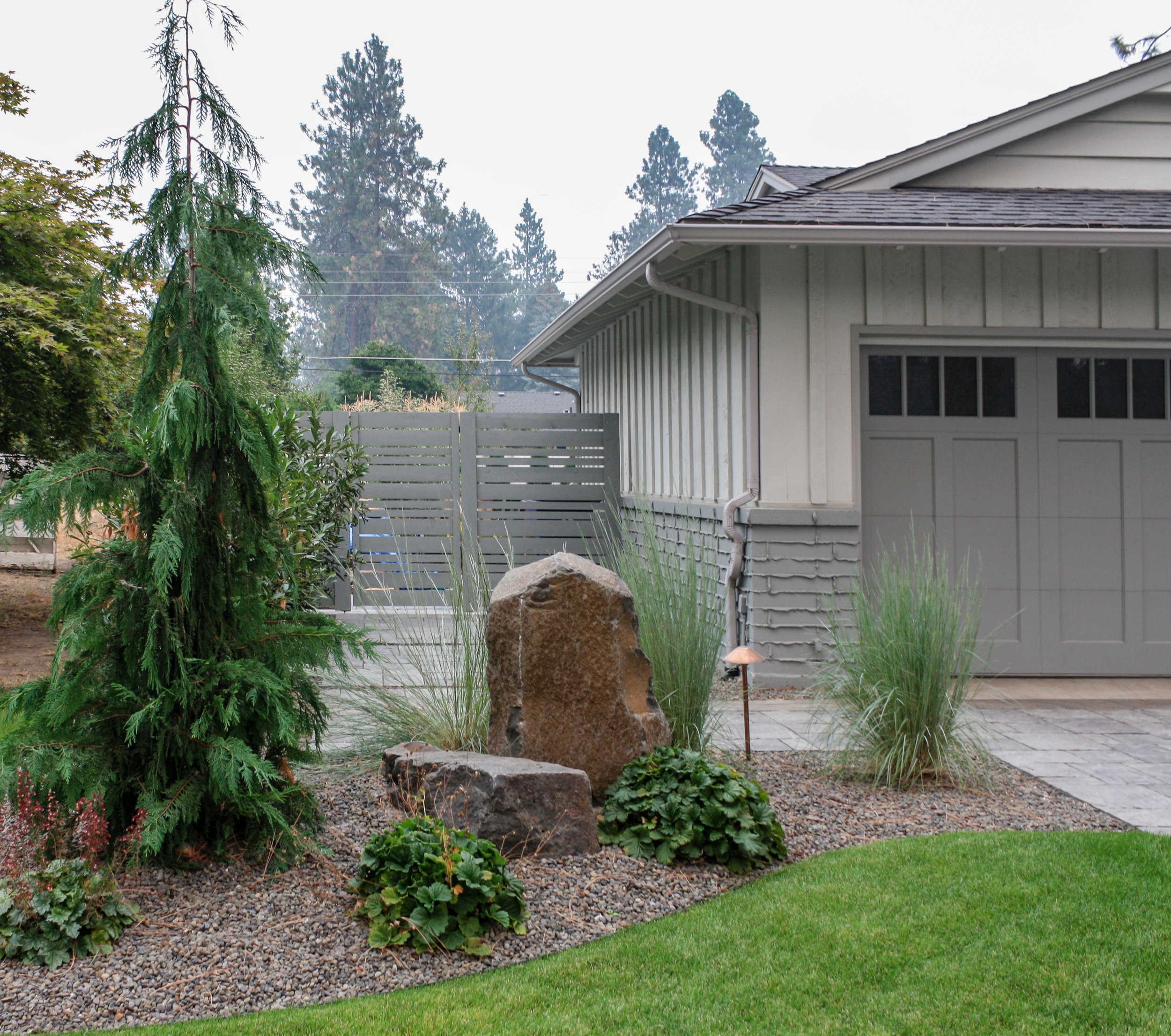 paver path with boulders and rock mulch