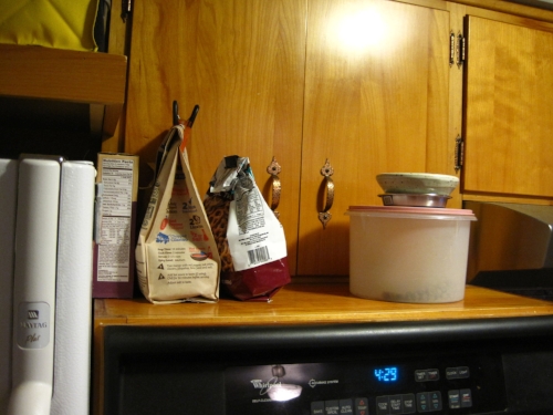 BEFORE: The step-back above the oven translated to clutter, and need for more space behind doors