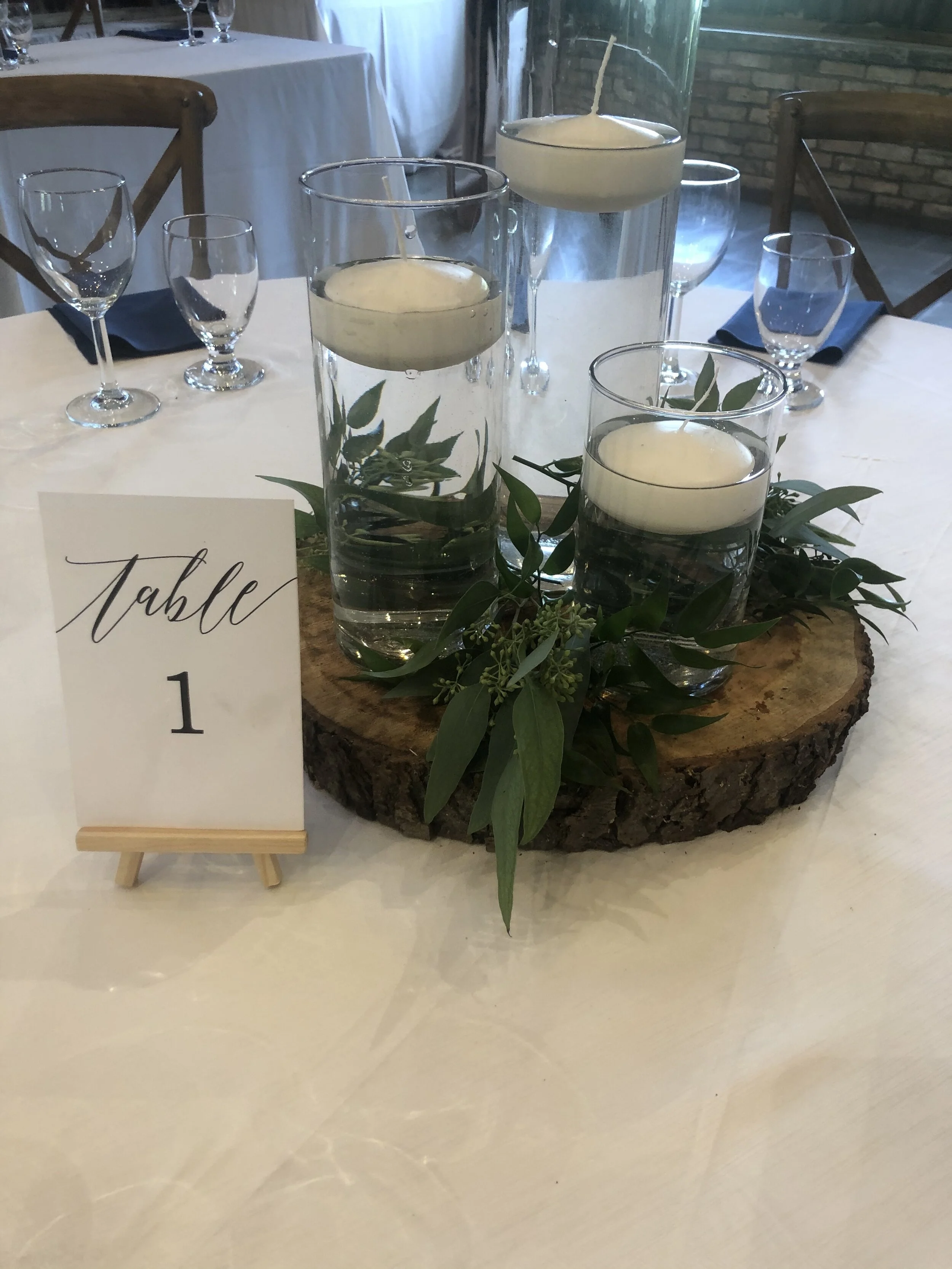 Trio Cylinder Vases with candles and greeney - $45.00 + HST