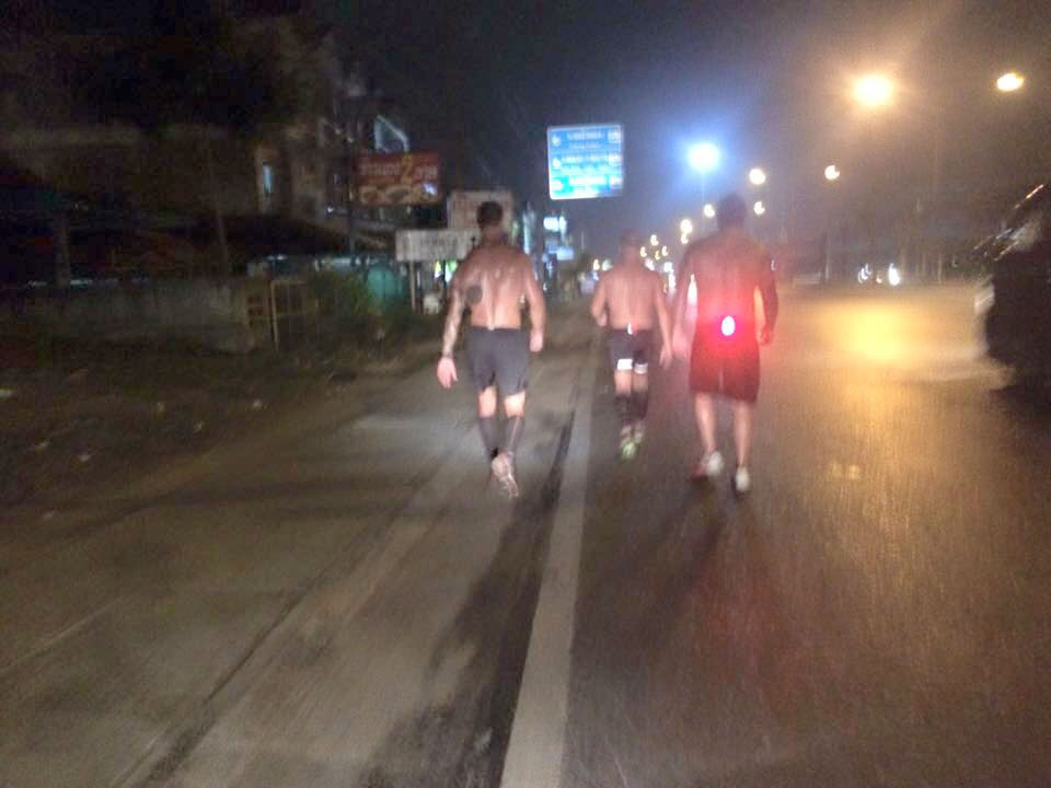 Making our way through a tropical downpour in Phuket City, about halfway through the challenge.
