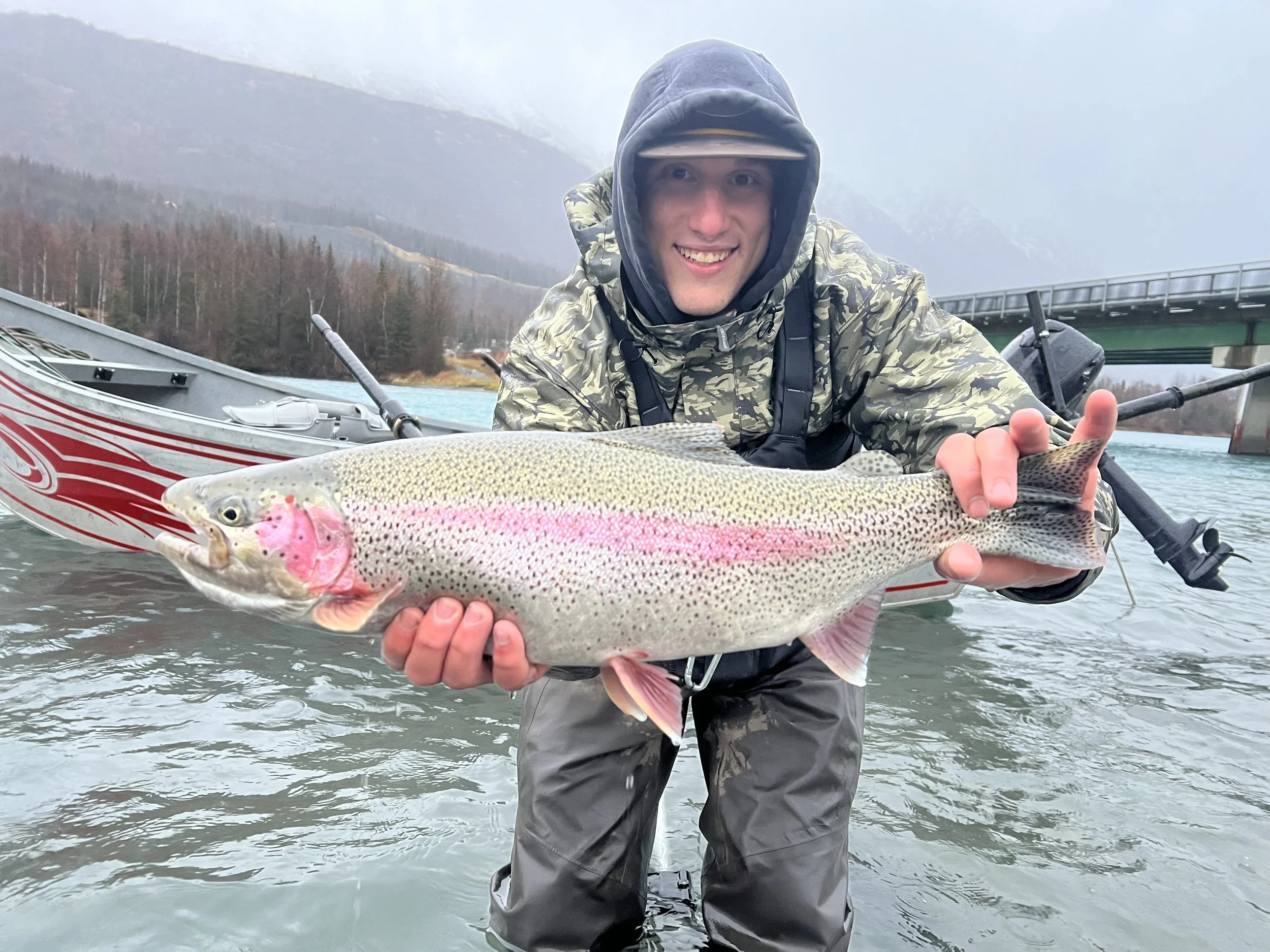 Fishing Guide holding a rainbow trout