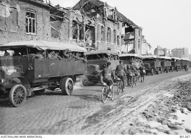 Flanders 1917; Kiwi troops being transported by truck, but note the soldiers, including a Scotsman in his kilt, riding in the opposite direction