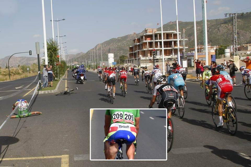 Peter Sagan sent flying by a race moto, yes that's an open wound on his leg