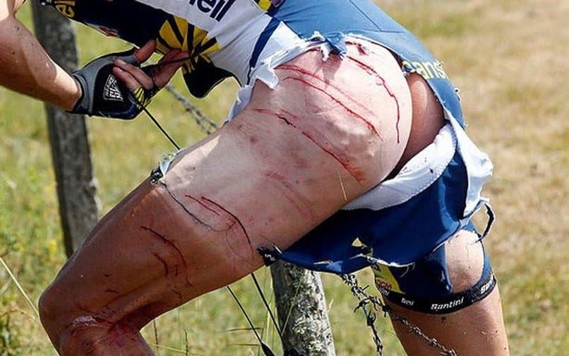 J onny Hoogerland preserves the shreds of his dignity but not much else as he is forced through a barbed-wire fence after a crash with a TdF media car. Three years later he received his insurance pay-out.