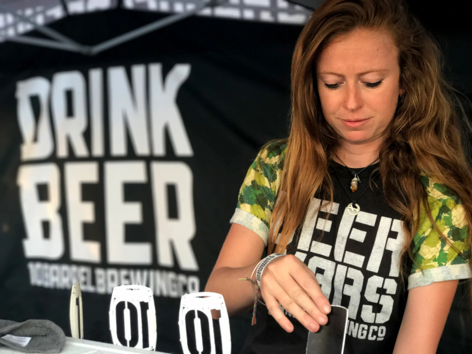 A 10 Barrel Brewing staff member pours a sample of the winning IPA.