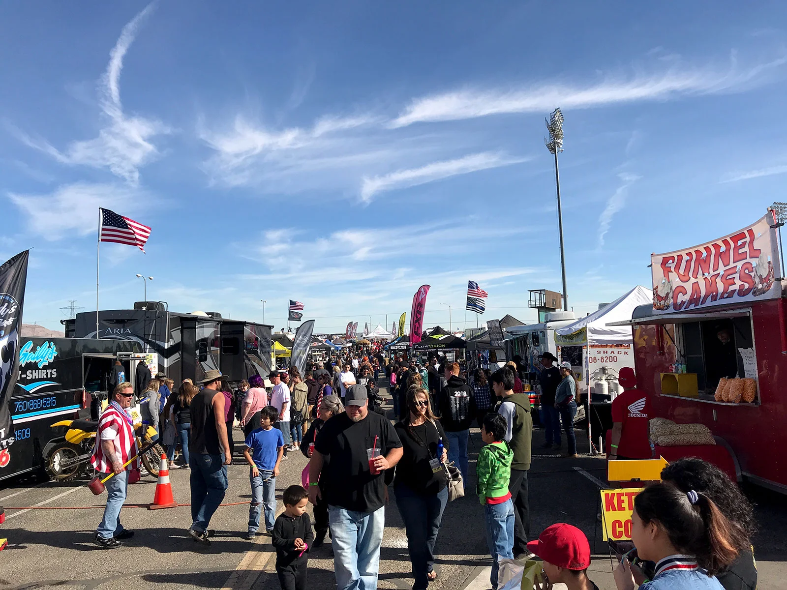 Vendors row is a mash-up of a music festival, trade show, and state fair with plenty of good food and things to do.