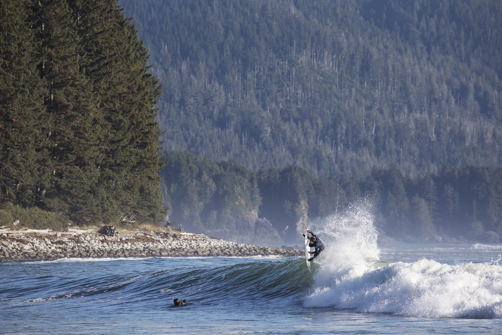 When we reached the shore at our final destination the following morning, our bleary eyes and foggy memories from last night’s fun quickly evaporated, replaced with excited squeals and blissful cries at what lay before us. Turquoise peeling peaks ran off in both directions, glistening in the midday sun. The crowd was minimal, with only a handful of other local surfers sharing the lineup, and all of whom we were well acquainted with from the beaches back in Tofino.