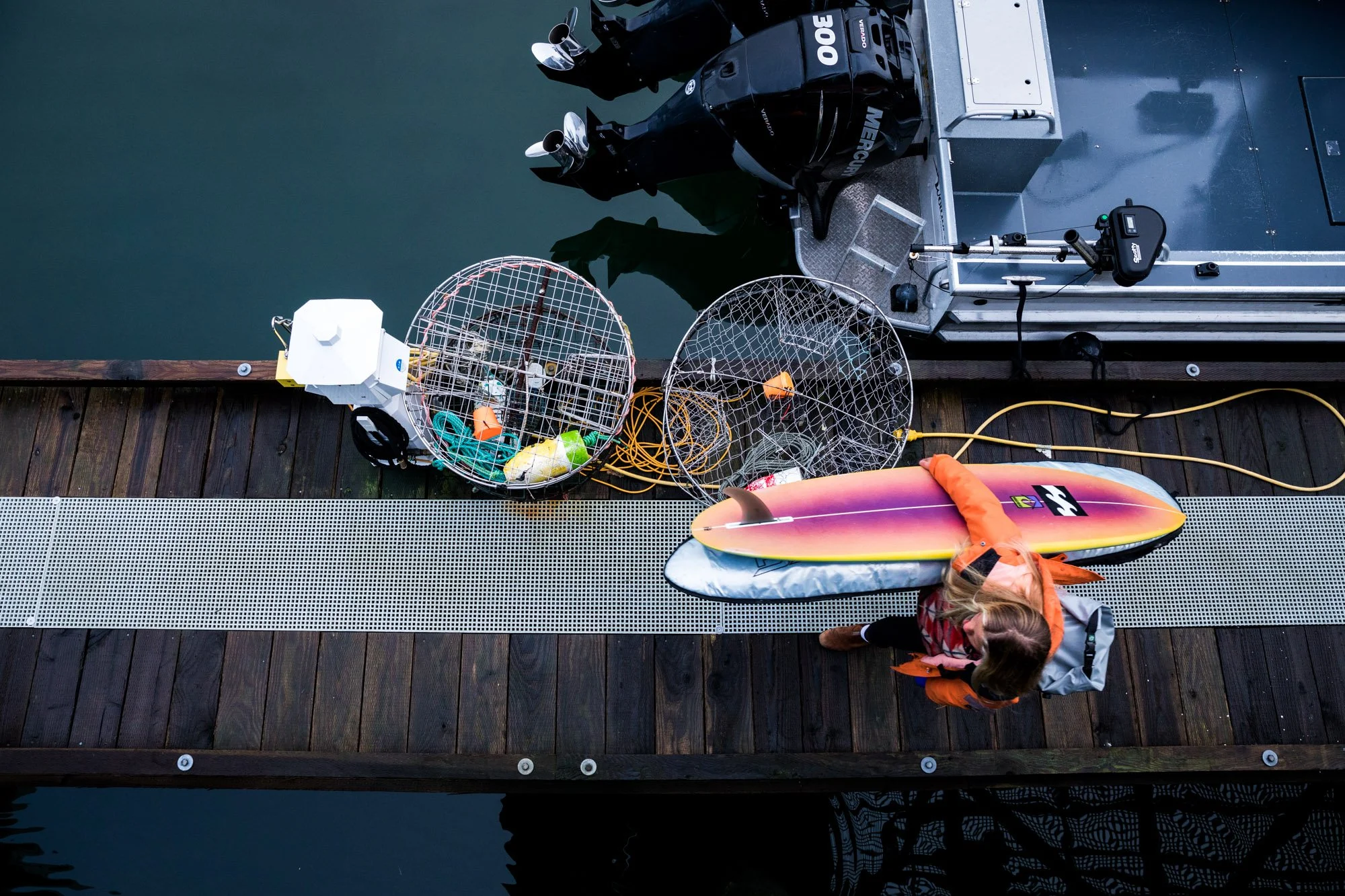  Arriving a short distance from the spot, we saw long lines curve and transform from soft, moving shoulders to walls tapered and polished that hugged the reef and seemed to pick up speed, winding around this point towards the center of the bay. We fo