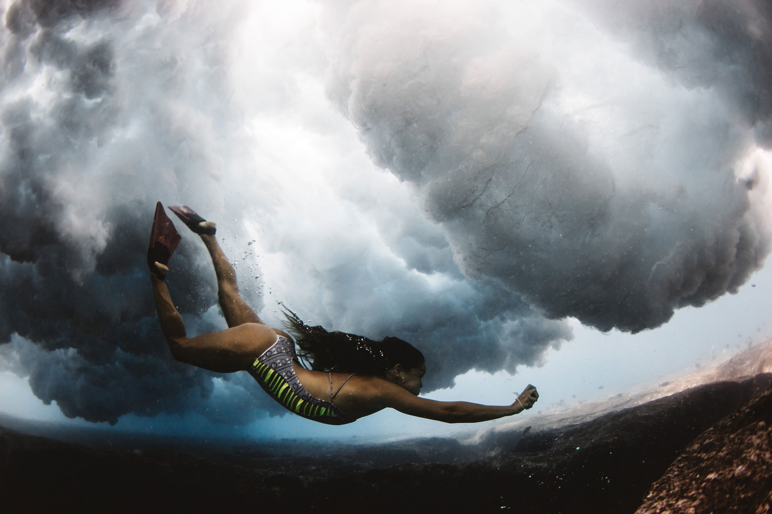 bikini babe below the waves at pipeline 