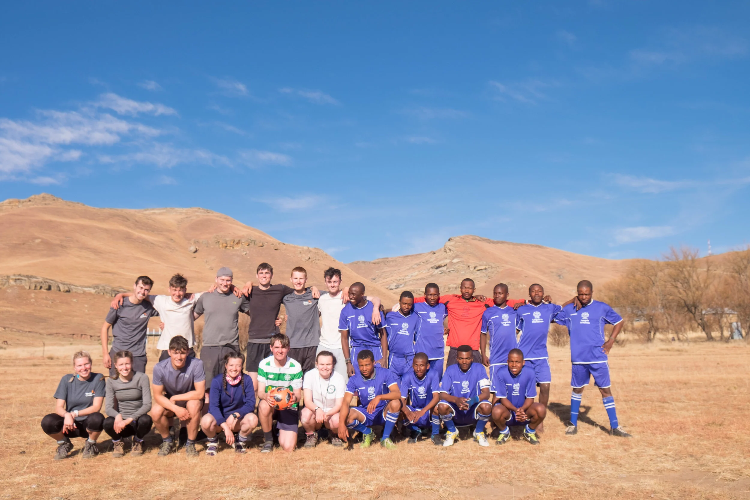 Being invited to take part in a football match in Lesotho.
