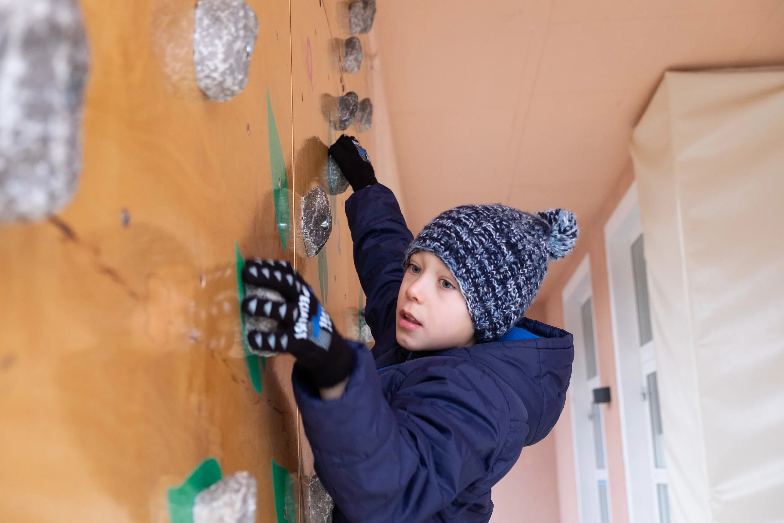 Gabriel shows off the Smart Stones wall at Stanjel Primary School.