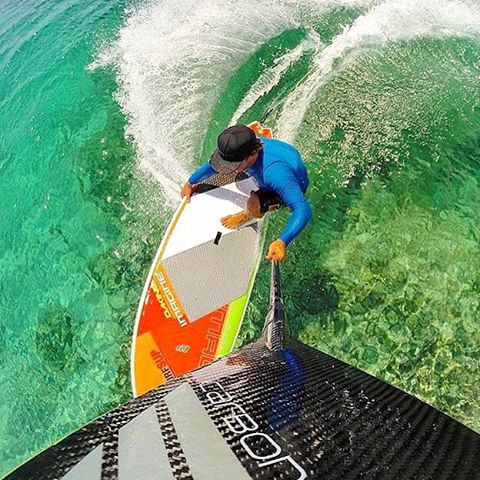 Team Rider 🔘 Wes Matweyew grabbing rail as he carves his way through the crystal clear waters of Turks &amp; Caicos. Photo: @goprohobbit #carbonerrocam #sup #paddlesurf #stand_up_paddle #standuppaddle #standuppaddling #paddle #paddlelife #gopro #gop