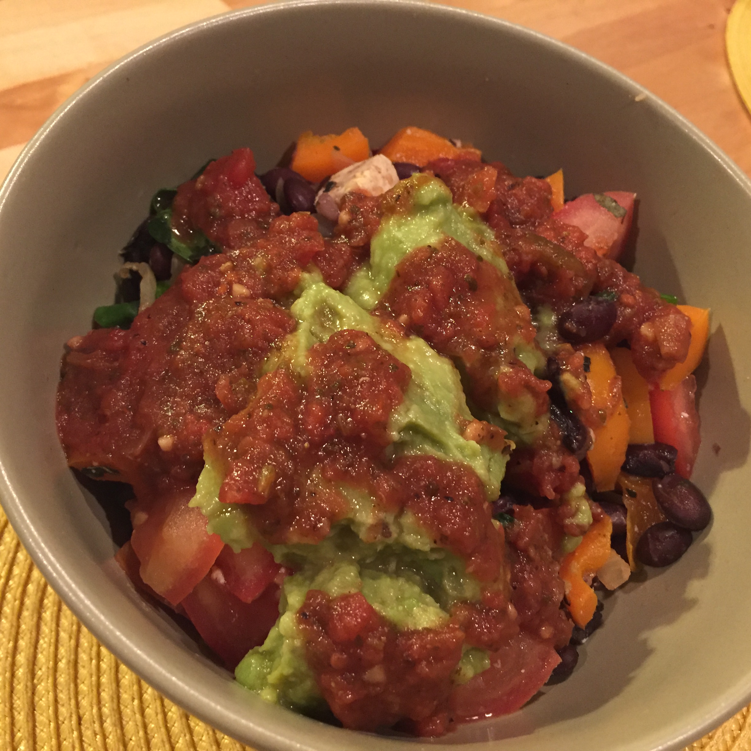Black bean veggie fiesta with quinoa, guacamole and salsa