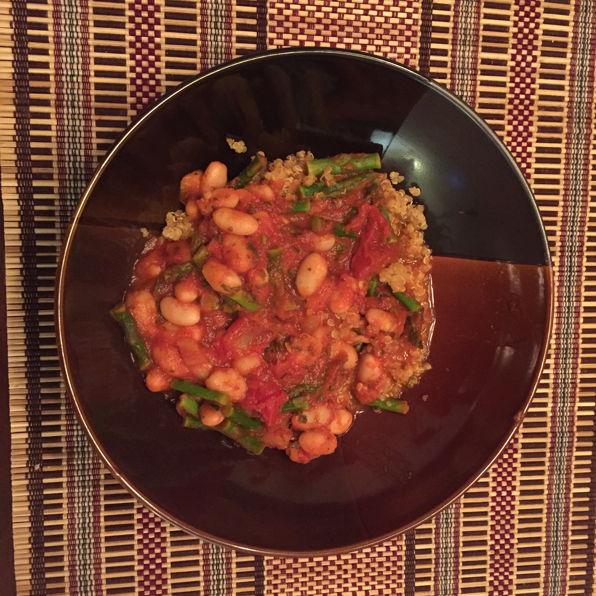 Marinara with white beans and asparagus served over quinoa