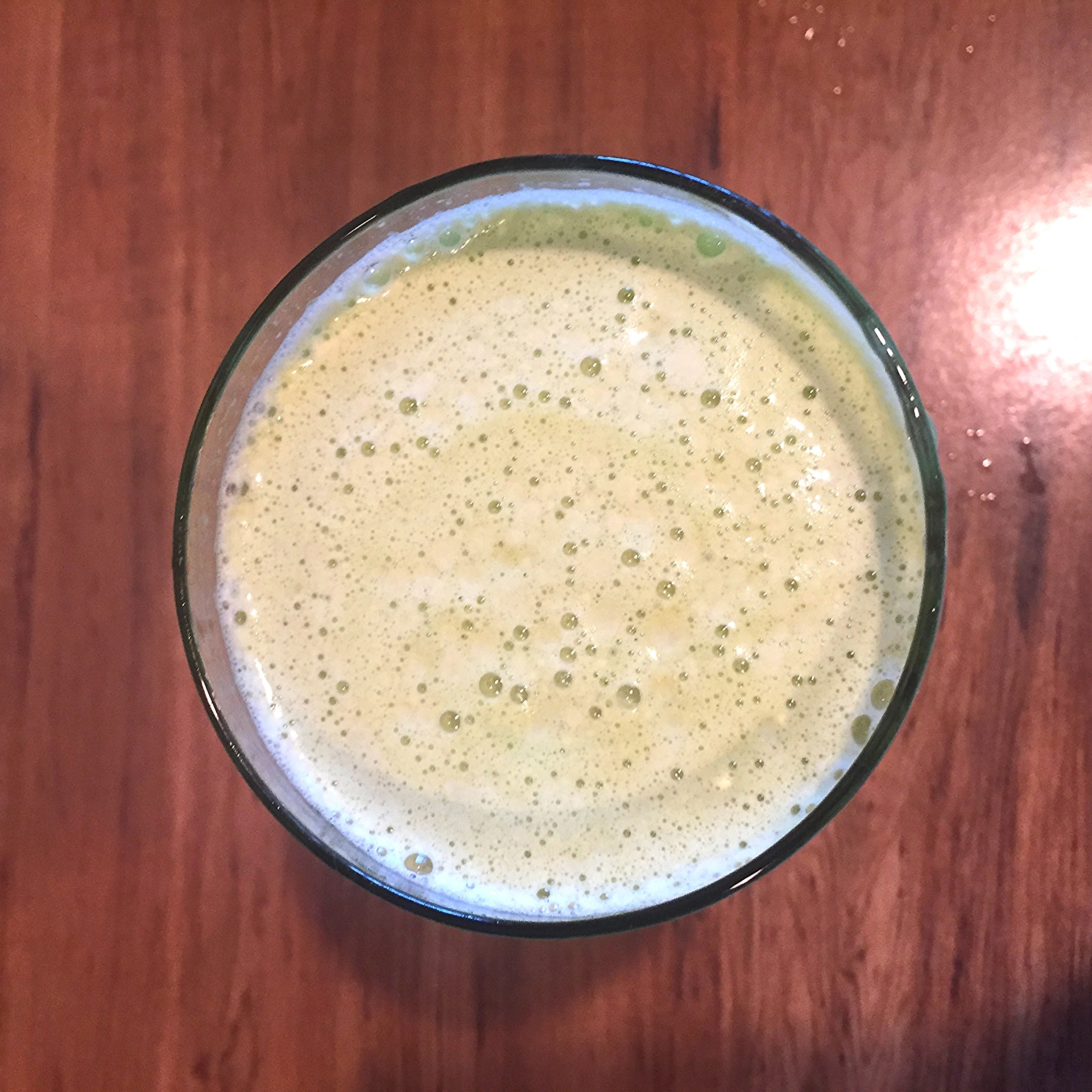A frothy and refreshing pineapple, cucumber and celery juice