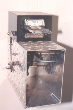 HAVING A BAD DAY? PLEASE DEPOSIT 50 CENTS. Welded aluminum plate, Pine, coin mechanism, carburetor linkage and a found toy gun.