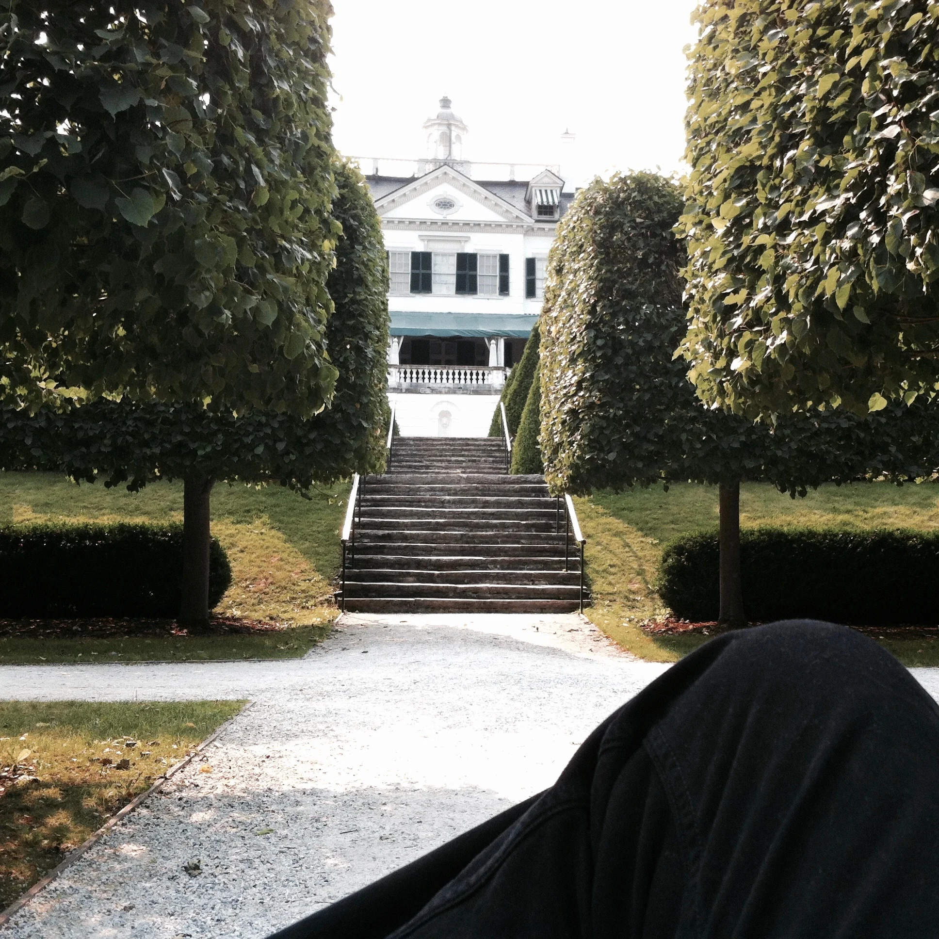 Sitting on a bench in the center of the gardens. — N.M-Y. '15
