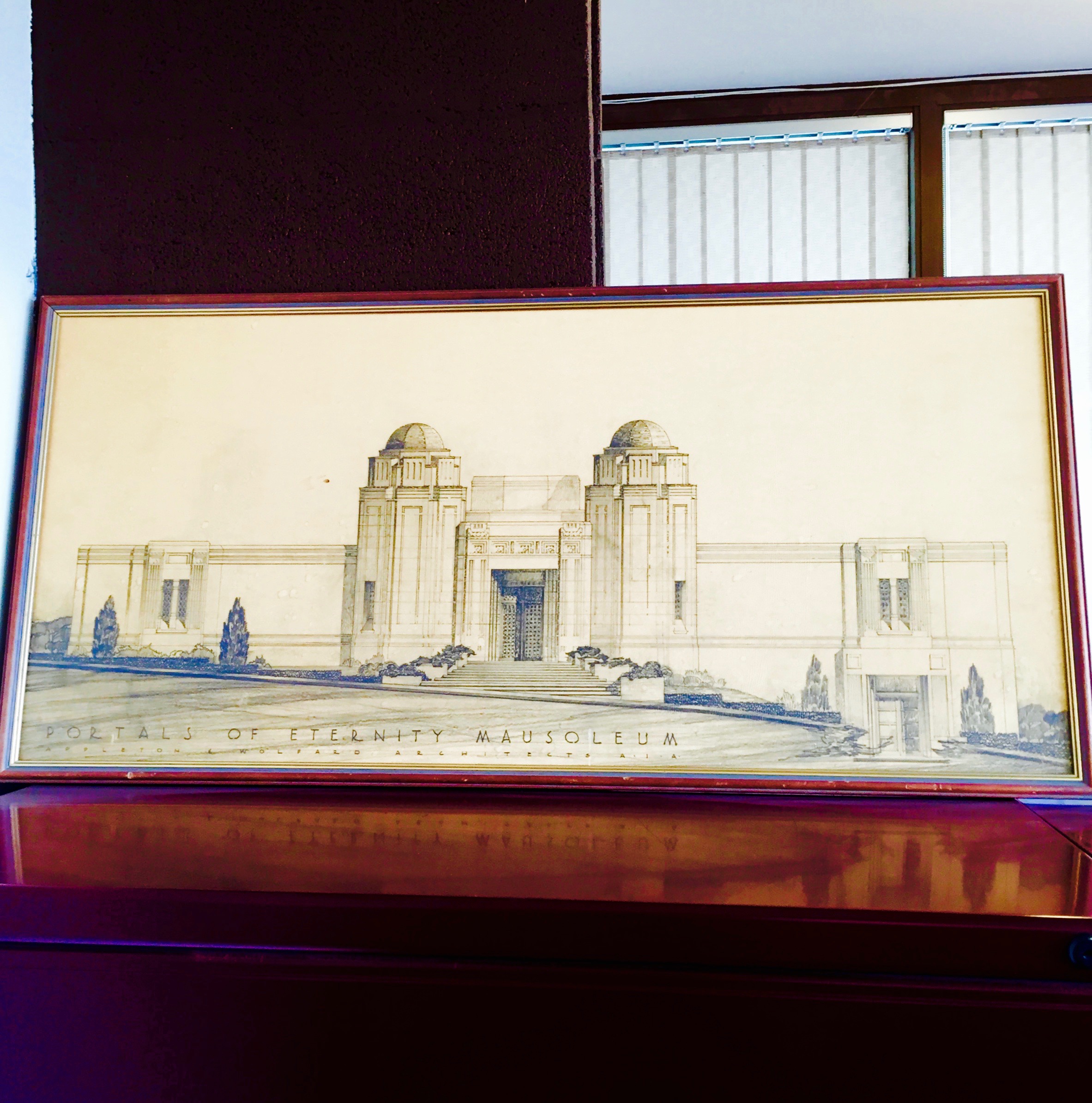 An architectural drawing of the Portals of Eternity mausoleum in the offices of the Hills of Eternity Memorial Park. — N.M-Y. '15