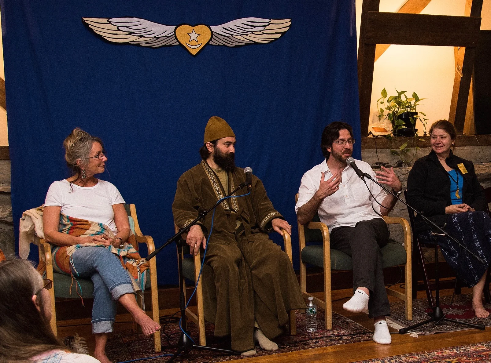 Taj Inayat, Pir Zia Inayat-Khan, and Netanel Miles-Yépez (speaking) during the sohbet session in the Meditation Hall, Abode of the Message. Photo by Hilary Benas, 2015