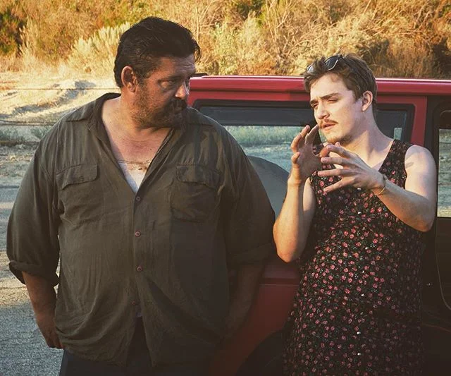 Kyle Gallner (in street clothes) explains to Danny Mora how IMDB voting works and that it would be great to get some 9's to combat the bitter, male over 45 vote. #bandofrobbers