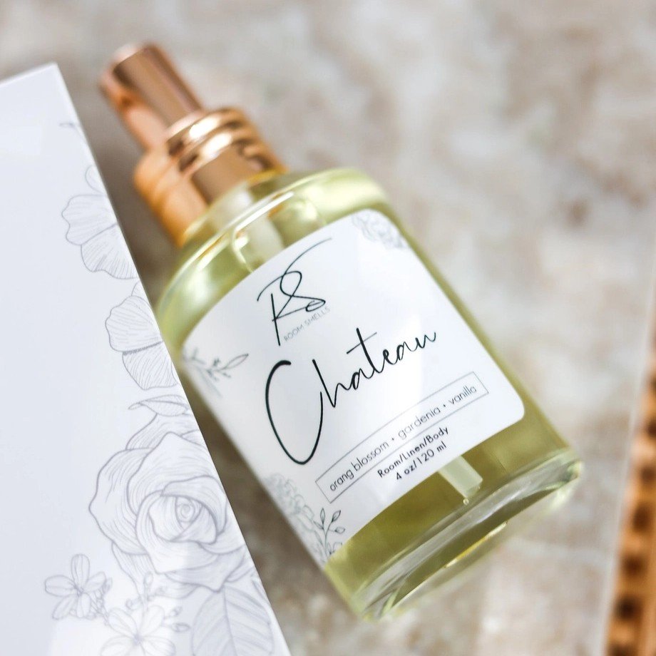 Women's perfume in a glass bottle with orange blossom, gardenia, and vanilla fragrance notes.