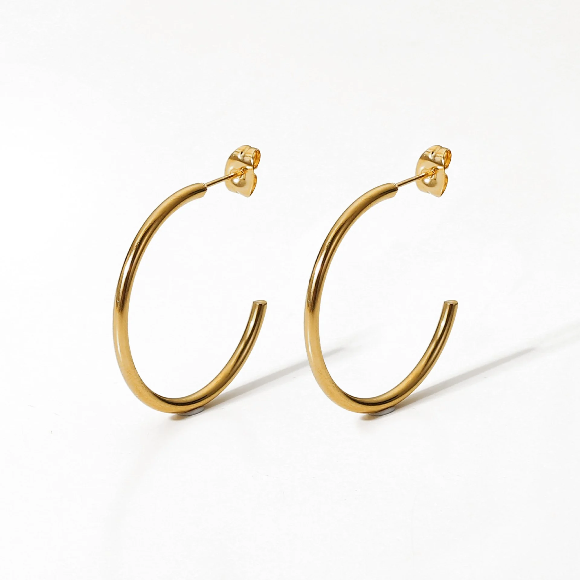 Gold classic hoop earrings for women.